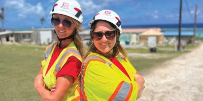 Christina Etzrodt and Clara Baber of the U.S. Army Corps of Engineers Omaha District work side by side in Saipan May 31, 2026 in the aftermath of Super Typhoon Sinlaku, combining technical expertise and compassion as a mother-daughter team helping families rebuild and recover storm-damaged homes.