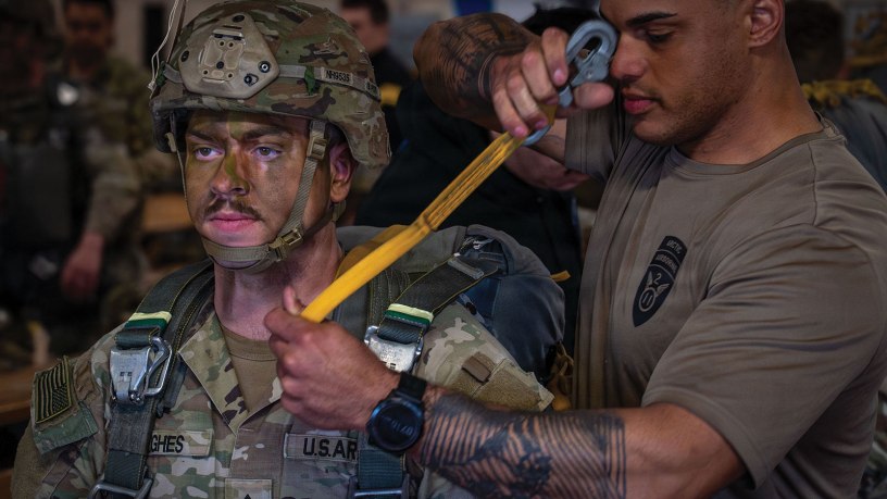 U.S. Army paratroopers assigned to the 2nd Infantry Brigade Combat Team (Airborne), 11th Airborne Division conduct pre-jump rigging inspections prior to an airborne operation during RED FLAG-Alaska 26-2 at Joint Base Elmendorf-Richardson, Alaska, June 1, 2026.