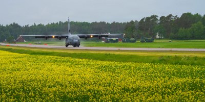 A U.S. Air Force C-130J Super Hercules aircraft assigned to the 37th Airlift Squadron lands on Highway 44 near Särestad, Sweden, June 2, 2026. The narrow roadway required crews to adapt standard operating procedures while demonstrating the flexibility of Agile Combat Employment concepts. (U.S. Air Force photo by Tech. Sgt. Cynthia Belío)