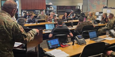 Representatives from multiple state agencies participate in a wildfire response tabletop exercise in Cheyenne, Wyoming, June 3, 2026.