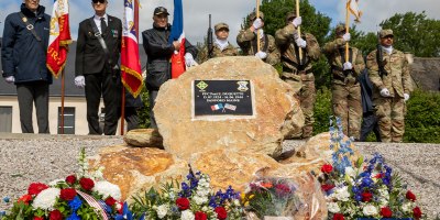 The memorial honoring Pvt. 1st Class Paul E. Duquette is displayed during a commemorative ceremony in Normandy, June 4, 2026. Floral tributes, military colors and presence of Soldiers and community members reflected the lasting gratitude for Duquette’s service during the D-Day Invasion. (U.S. Army photo by Spc. Aysia Hightree)