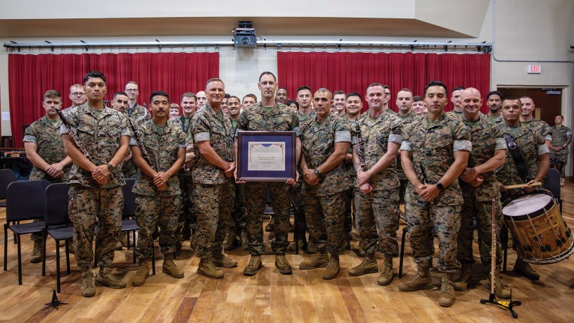 U.S. Marine Corps Lt. Gen. Leonard F. Anderson IV, commander of Marine Forces Reserve and Marine Forces South, and Sgt. Maj. Edwin A. Mota, command senior enlisted advisor of Marine Forces Reserve and Marine Forces South, pose for a photo with the Marine Forces Reserve Band during a ceremony at Marine Forces Support Facility New Orleans, June 4, 2026.
