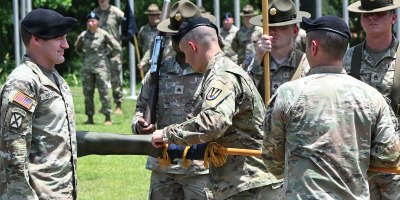 Col. Joshua Betty, 165th Infantry Brigade commander, looks on as the 2nd Battalion, 39th Infantry Regiment colors are encased during a ceremony held June 9.