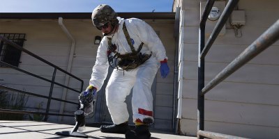 Maj. Daniel S. Godlasky, a nuclear operations officer with the 20th Chemical, Biological Radiological, Nuclear, Explosives (CBRNE) Command, collects simulated nuclear debris during Exercise Prominent Hunt in the Colorado Springs, Colorado area June 8 – 12.