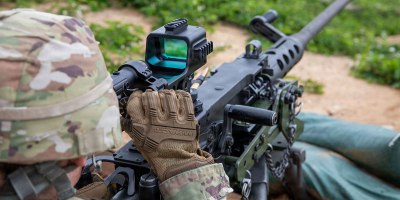 U.S. Army Sgt. Eleanor Osgood, assigned to the 126th Theater Public Affairs Support Element, Michigan Army National Guard, operates the M155 mounted machine gun optic to zero the M2 Browning machine gun, at Camp Grayling, Michigan, June 9, 2026.