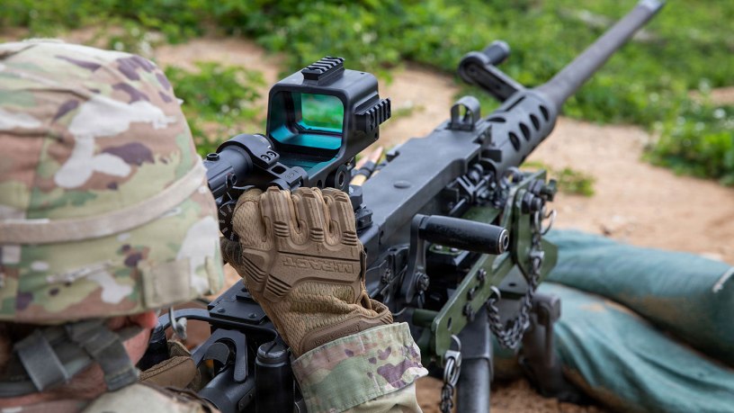 U.S. Army Sgt. Eleanor Osgood, assigned to the 126th Theater Public Affairs Support Element, Michigan Army National Guard, operates the M155 mounted machine gun optic to zero the M2 Browning machine gun, at Camp Grayling, Michigan, June 9, 2026.