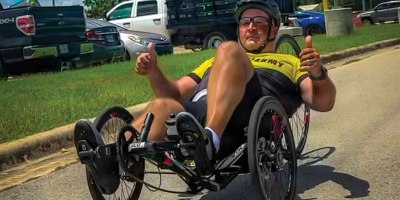 Retired Master Sgt. Christopher Morago, a Team Army competitor, gives two thumbs up while riding a recumbent bike during practice ahead of the 2026 Warrior Games in San Antonio, Texas, June 10, 2026.