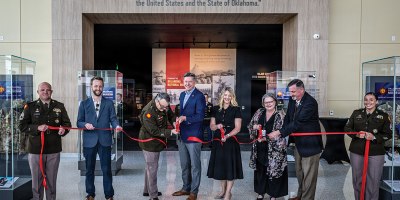 Jay Fox, Hensel Phelps Construction; Maj. Gen. Thomas H. Mancino, adjutant general for Oklahoma, Mayor David Holt, mayor of Oklahoma City, Mrs. Cindy Lankford, representing Senator James Lankford; Dr. Denise Neil, Oklahoma National Guard Museum executive director, join in the ribbon cutting for the Oklahoma National Guard Museum in Oklahoma City, June 11, 2026. (Oklahoma National Guard photo by Anthony Jones)