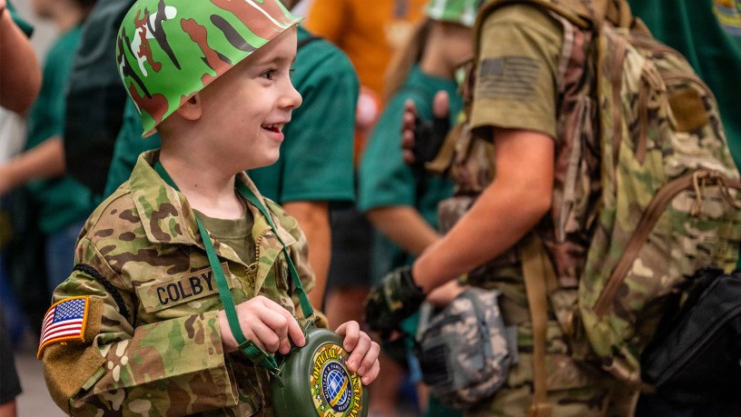 Colby Madany waits for Operation Hooah to start on Joint Base San Antonio-Fort Sam Houston, Texas, June 11, 2026. Operation Hooah is an interactive, mock deployment for military children to experience what their deployed parents go through, while building resilience and celebrating the military community. (U.S. Air Force photos by Melissa Hydrick)