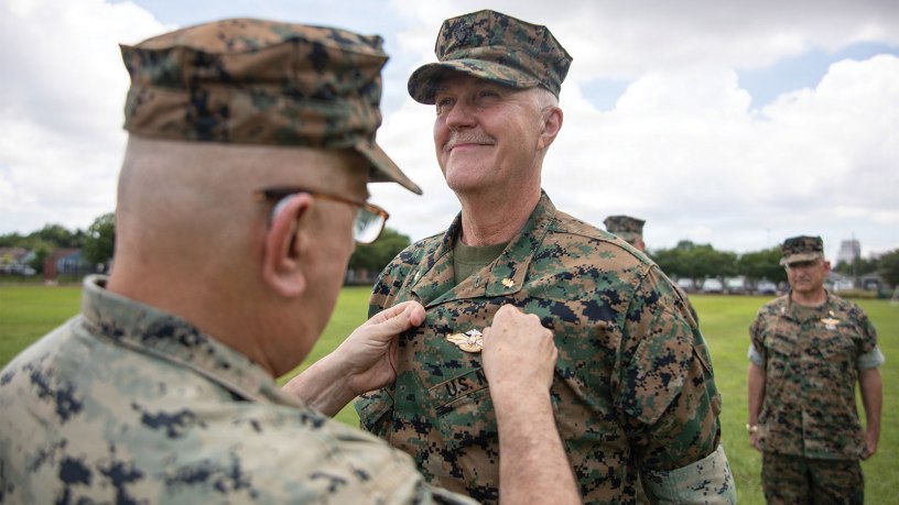 U.S. Navy Rdml. Anthony Lacourse, reserve medical officer, Marine Forces Reserve, pins Fleet Marine Force insignia on Lt. Cmdr David Westenberg, dentist, 4th Dental Battalion, during a Fleet Marine Force (FMF) pinning ceremony at Marine Forces Reserve, June 11, 2026.