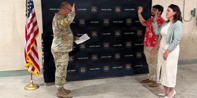 Katherine and Matthew Zito, raises their right hand during their enlistment swear in as Maj. Andrew Line swears them into the Pennsylvania Army National Guard in Gettysburg, Pennsylvania, June 12, 2026.