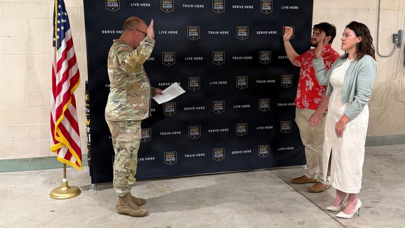 Katherine and Matthew Zito, raises their right hand during their enlistment swear in as Maj. Andrew Line swears them into the Pennsylvania Army National Guard in Gettysburg, Pennsylvania, June 12, 2026.
