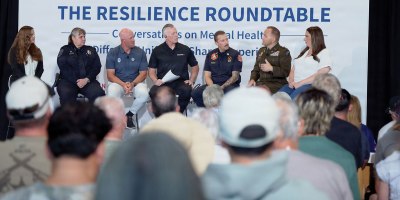 Major League Baseball alumni, local first responders, and Master Sgt. Rebecca Anderson, 775th Explosive Ordnance Disposal Flight section chief, participate in a mental health resilience panel during the "In the Open" event at the Salt Lake Bees Ballpark in South Jordan, Utah, June 13, 2026.