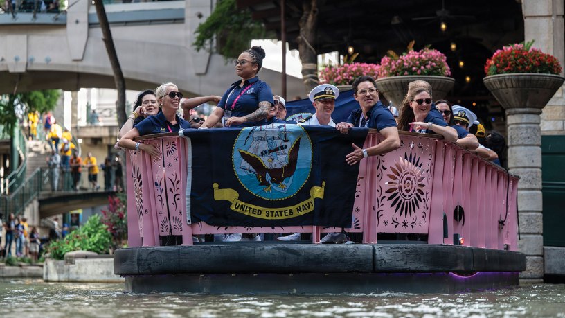 Competitors with the U.S. Navy Warrior Games team ride on a river boat in the San Antonio riverwalk during the Warrior Games. The Warrior Games recognize the critical role families, caregivers, and supporters play in each competitor’s recovery journey.