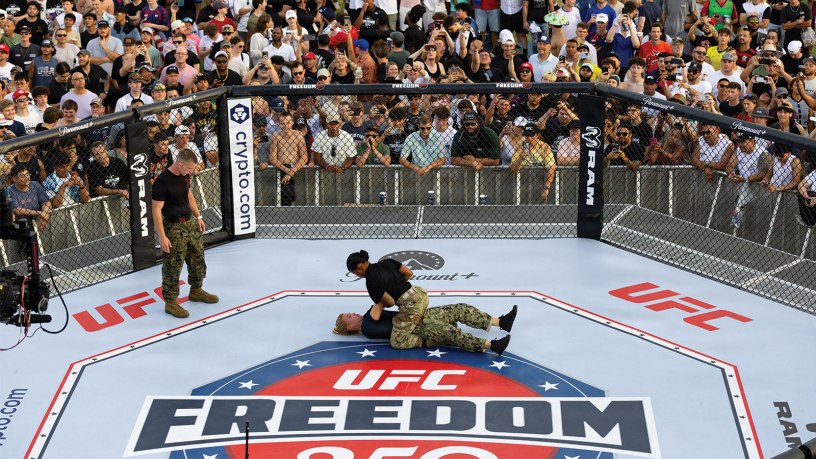 U.S. Army Sgt. 1st Class Anais A. Moise and U.S. Navy Lt. Margaret B. Peacher demonstrate combatives techniques inside the octagon during UFC Freedom 250 events at the Ellipse in Washington, D.C., June 14, 2026. The demonstration showcased hand-to-hand combat skills, physical readiness, and joint service participation in front of attendees gathered near the Washington Monument. (U.S. Army photo by Sgt. 1st Class Brittany Primavera)