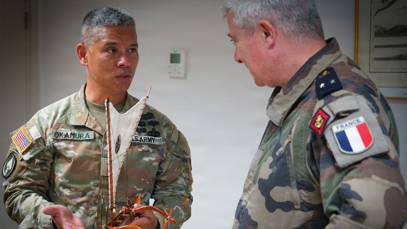 Maj. Gen. Lance Okamura, deputy commanding general of U.S. Army Pacific–Homeland Affairs, presents a traditional Hawaiian voyaging canoe to Rear Adm. Guillaume Pinget, commander of the French Armed Forces in French Polynesia, during a gift exchange following a distinguished visitor day for Exercise MARARA 26 in Tahiti, French Polynesia, June 16, 2026.
