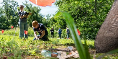 Fort Leonard Wood Directorate of Public Works Environmental Division employees, Elizabeth Woods (left), Natural Resources technician; and Andrew Phillips, archeologist, process a mock cultural resources crime scene June 17, 2026, behind Countee Hall.