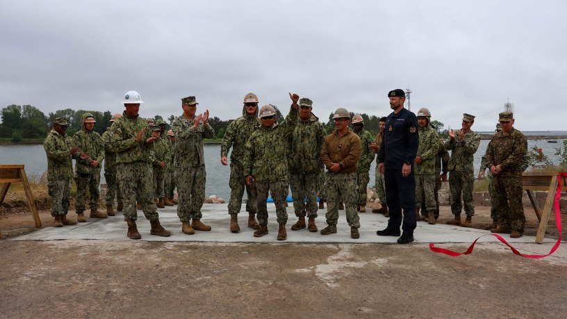 U.S. Navy Sailors, assigned to Amphibious Construction Battalion (ACB) 1, conduct a ribbon cutting ceremony during Baltic Operations (BALTOPS) 2026, in Liepaja, Latvia, June 18, 2026.