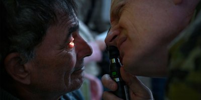 U.S. Air Force Lt. Col. Kirk Drennan, an optometrist with the Utah Air National Guard’s 151st Medical Group performs an eye exam at Unidad de Salud Familiar Niño de Jesús in Asuncion, Paraguay June 18 as part of exercise Amistad 2026.