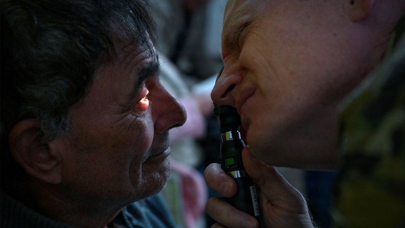 U.S. Air Force Lt. Col. Kirk Drennan, an optometrist with the Utah Air National Guard’s 151st Medical Group performs an eye exam at Unidad de Salud Familiar Niño de Jesús in Asuncion, Paraguay June 18 as part of exercise Amistad 2026.