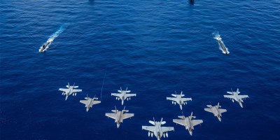 U.S. Navy aircraft, attached to Carrier Air Wing (CVW) 5, and U.S. Air Force F-35A Lightning IIs fly over U.S. Navy George Washington Carrier Strike Group as it sails in formation with Japan Maritime Self- Defense Force as part of Valiant Shield 2026 while underway in the Philippine Sea, June 21, 2026.