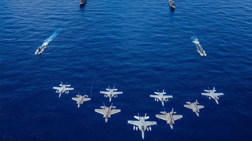 U.S. Navy aircraft, attached to Carrier Air Wing (CVW) 5, and U.S. Air Force F-35A Lightning IIs fly over U.S. Navy George Washington Carrier Strike Group as it sails in formation with Japan Maritime Self- Defense Force as part of Valiant Shield 2026 while underway in the Philippine Sea, June 21, 2026.