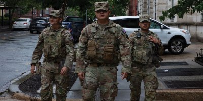 From left to right, U.S. Army Pfc. Gabriel Oliva, Sgt. Memphis Perez, and Spc. Edwin Martinez, all with the Arkansas National Guard assigned to Joint Task Force-District of Columbia in support of the DC Safe and Beautiful, mission patrol near Thomas Circle in Washington, June 23, 2026.