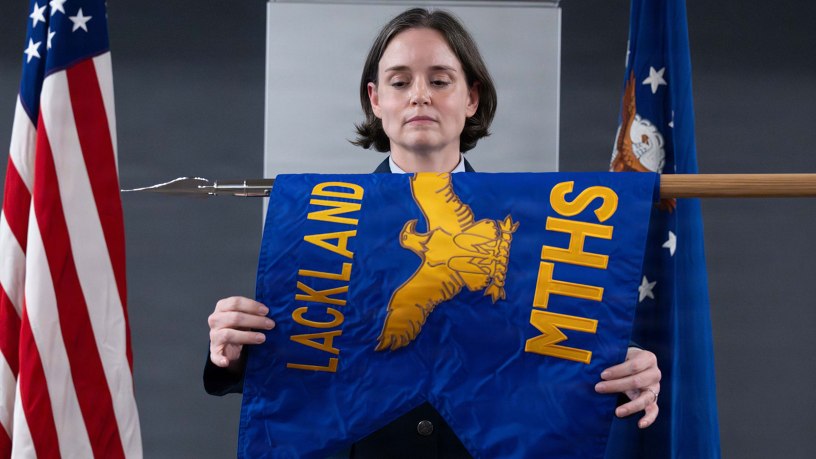 U.S. Air Force Col. Shawn Garcia, commander of the Lackland Medical Group, unfurls the newly activated Lackland Mental Health Squadron guidon during an activation ceremony at Wilford Hall Ambulatory Surgical Center, Joint Base San Antonio-Lackland, Texas, June 25, 2026.