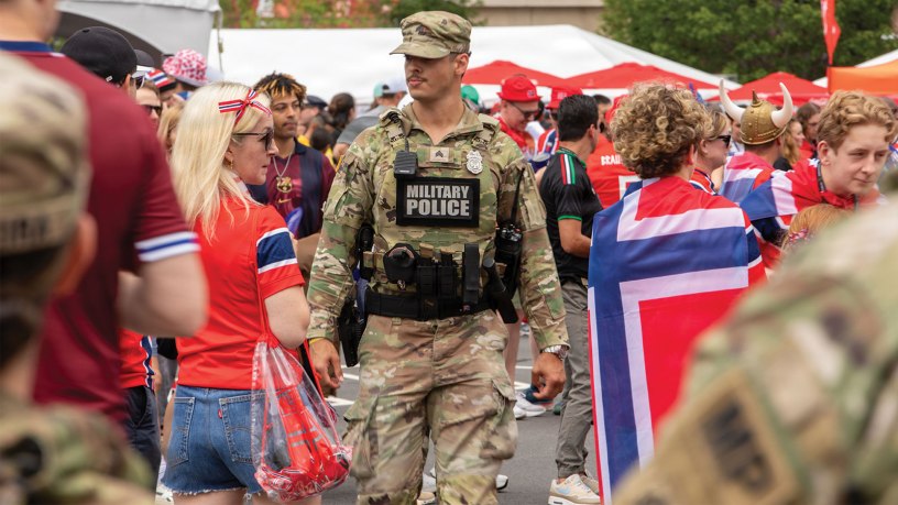 A Soldier from the 972nd Military Police Company, Massachusetts National Guard, walks through the fan experience zone at Boston Stadium before a FIFA World Cup game, June 26, 2026.