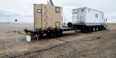 Boeing's laser system intended for dual-use in power beaming and aerial defense sits in the field for testing. The U.S. Naval Research Laboratory works with Boeing and the U.S. Army in testing the capability of a dual-use laser systems. (U.S. Navy photo by Jonathan Steffen-Arnold)
