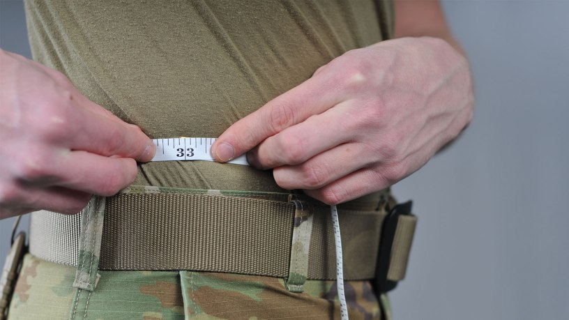 An Airman of the 185th Air Refueling Wing measures his waist at the 185th Air Refueling Wing in Sioux City, Iowa, Jan. 11, 2024.