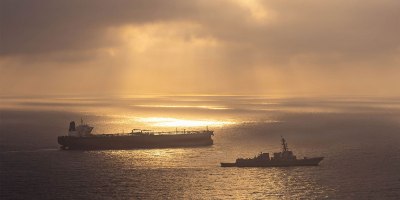 Arleigh Burke-class guided-missile destroyer USS Rafael Peralta (DDG 115) enforces a maritime blockade against an Iranian-flagged ship attempting to sail toward an Iranian port, April 24, 2026.