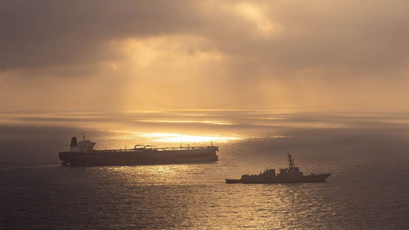 Arleigh Burke-class guided-missile destroyer USS Rafael Peralta (DDG 115) enforces a maritime blockade against an Iranian-flagged ship attempting to sail toward an Iranian port, April 24, 2026.