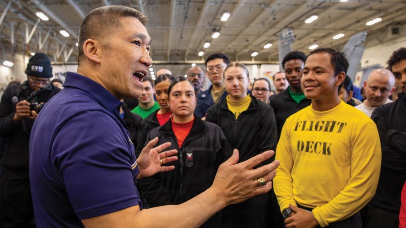 The Honorable Hung Cao, Acting Secretary of the Navy, left, speaks to Sailors in the hangar bay of the world’s largest aircraft carrier, USS Gerald R. Ford (CVN 78), while underway in the Mediterranean Sea, May 4, 2026.
