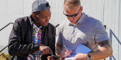 U.S. Army Master Sgt. Joseph Buth, right, team sergeant assigned to Civil Affairs Team Botswana, Bravo Company, Civil Affairs Battalion, U.S. Army Southern European Task Force, Africa (SETAF-AF), exchanges contact information after conducting an assessment of prefabricated clinics with Malefo Kgosimore, left, administrative officer-accountant at Bobonong Primary Hospital, in Bobonong, Botswana, May 9, 2026.
