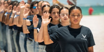 Alliyah Collier, one of hundreds of future service members, stands in formation for the Oath of Enlistment administered by Air Force Chief of Staff Gen. Ken Wilsbach at the Hyundai Air and Sea Show, May 23, 2026, Miami Beach, Florida.