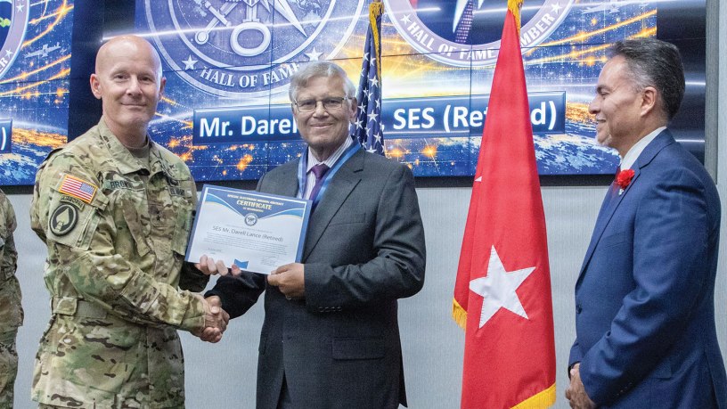 Maj. Gen. Timothy D. Brown, then-commanding general, U.S. Army Intelligence and Security Command (INSCOM), and George "Angel" Lopez, Jr. (right), INSCOM G3 Aerial Intelligence, Surveillance and Reconnaissance (A-ISR) director, pose with Darell Lance, Defense Intelligence Senior Executive Service (Ret.), U.S. Army Col. (Ret.), and former INSCOM chief of staff.