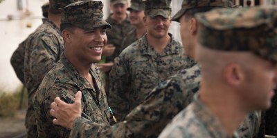 U.S. Marines with 3rd Battalion, 2nd Marine Regiment, Littoral Combat Force-24, congratulate Marine Corps Cpl. Myles Days, a rifleman with V32, LCF-24, after he received the Navy and Marine Corps Commendation Medal during an award ceremony on Roosevelt Roads Naval Station, Puerto Rico, June 8, 2026.