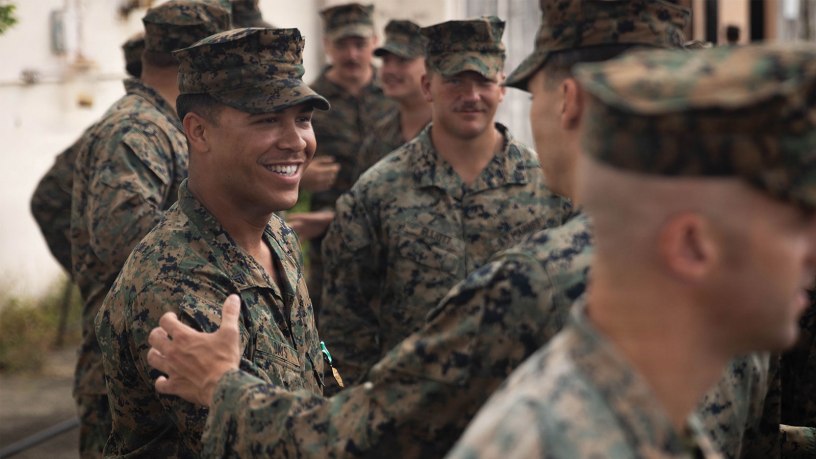 U.S. Marines with 3rd Battalion, 2nd Marine Regiment, Littoral Combat Force-24, congratulate Marine Corps Cpl. Myles Days, a rifleman with V32, LCF-24, after he received the Navy and Marine Corps Commendation Medal during an award ceremony on Roosevelt Roads Naval Station, Puerto Rico, June 8, 2026.