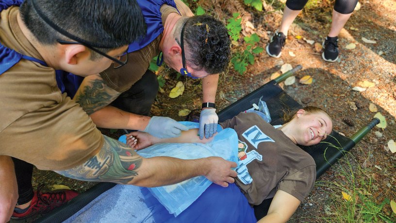 Sailors assigned to Naval Readiness and Training Command Bremerton treat a simulated casualty during the inaugural 2026 Corpsman Cup held Thursday, June 18, 2026.