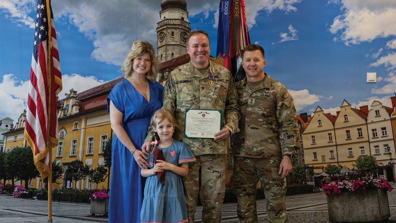 U.S. Army Col. Michael Filanowski, deputy chief of staff for operations for Multinational Division North East, NATO, stands for a picture with his family and U.S. Army Maj. Gen. John Lubas, commanding general of the 3rd Infantry Division, after receiving the Purple Heart on June 25, 2026, in Boleslawiec, Poland.