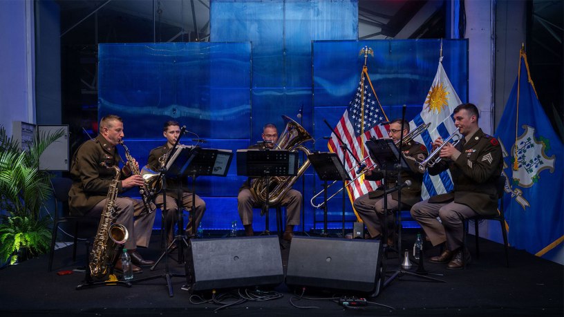 A quintet from the 102nd Army Band, Connecticut Army National Guard performs at an America 250 celebration in Montevideo, Uruguay on June 25, 2026. The performance marked the Connecticut Army National Guard band's first appearance in Uruguay and took place before senior U.S. and Uruguayan leaders during the nation's America 250 commemoration. (U.S. Air National Guard photo by Staff Sgt. Emme Drummond)