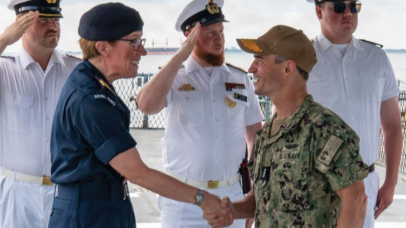 Vice Adm. Doug Perry, commander, U.S. 2nd Fleet, greets Commodore Maryla Ingham, commander, standing NATO Maritime Group 1, during a visit to German navy Sachsen-class air-defense frigate FGS Sachsen (F 219), at Naval Station Norfolk, June 29, 2026.