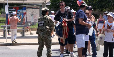 U.S. National Guard members supporting DC Safe and Beautiful hand out bottles of water to tourists visiting the Great American State Fair during Independence Day celebrations in Washington, D.C., July 4, 2026.