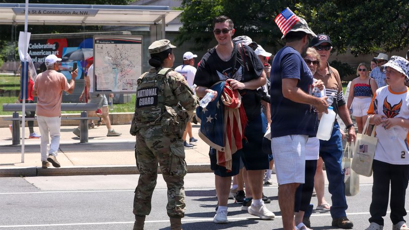 U.S. National Guard members supporting DC Safe and Beautiful hand out bottles of water to tourists visiting the Great American State Fair during Independence Day celebrations in Washington, D.C., July 4, 2026.