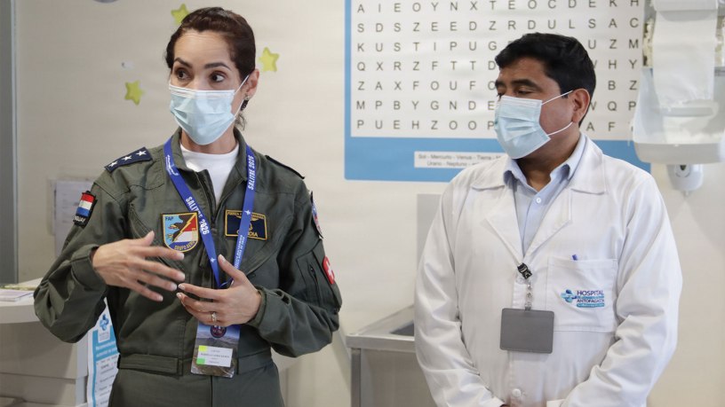 A Paraguayan air force representative participating in Exercise Salitre 2026 speaks with a representative from Hospital Regional de Antofagasta during a tour of the hospital’s pediatric wing in Antofagasta, Chile, July 6, 2026.