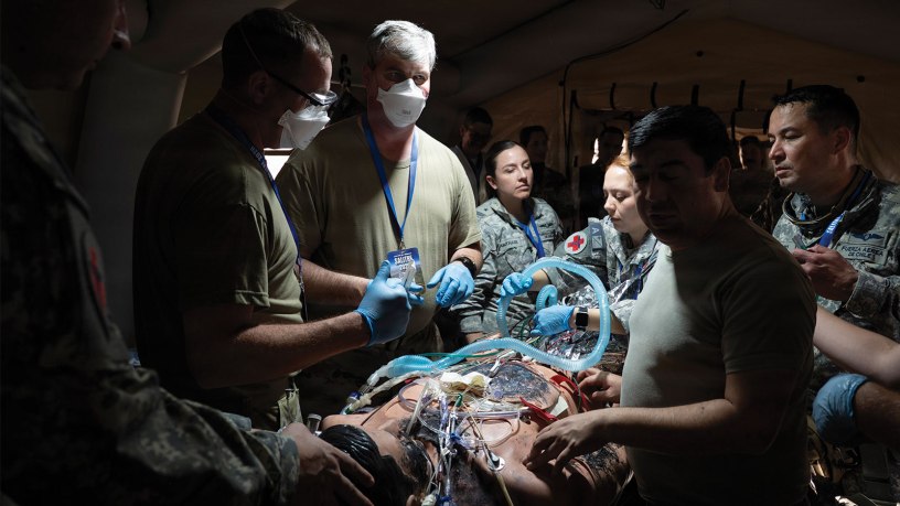 U.S. Air Force and Chilean air force medical service members perform a mock operation for an injured service member for a mass casualty training during Exercise Salitre 2026 at Cerro Moreno Air Base in Antofagasta, Chile, July 7, 2026.