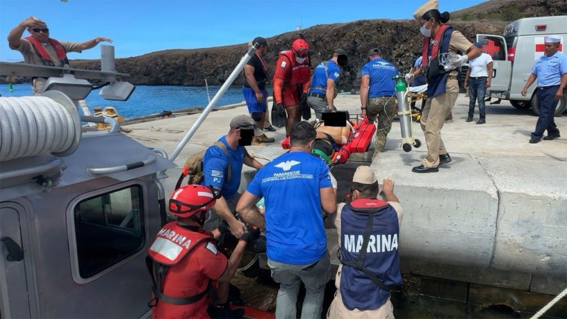 Pararescuemen from the 129th Rescue Wing's 131st Rescue Squadron, transfer a patient onto land at Socorro Island, July 7, 2026. The patient was treated at sea until he could receive higher medical care. (Courtesy Photo)