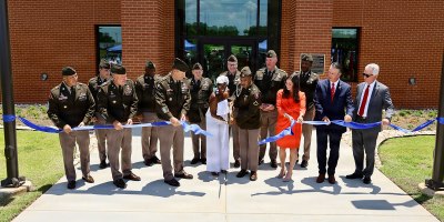 Army Aviation senior leaders, state and local elected officials, and family members of PFC Garfield M. Langhorn cut the ribbon on the 76,000 square-foot PFC Garfield M. Langhorn Advanced Individual Training Complex on Fort Rucker during a ribbon cutting and dedication ceremony July 9, 2026.