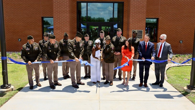 Army Aviation senior leaders, state and local elected officials, and family members of PFC Garfield M. Langhorn cut the ribbon on the 76,000 square-foot PFC Garfield M. Langhorn Advanced Individual Training Complex on Fort Rucker during a ribbon cutting and dedication ceremony July 9, 2026.